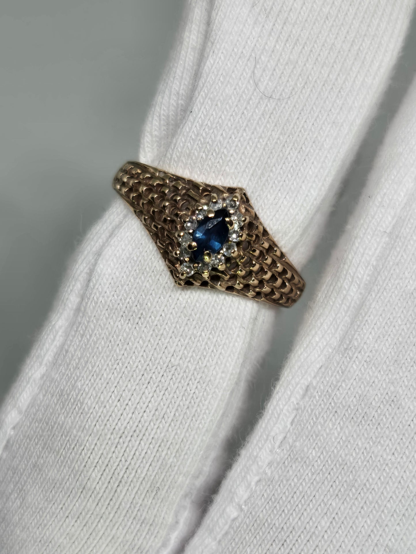 Marquise Cut Sapphire Ring with Diamond Halo in Yellow Gold