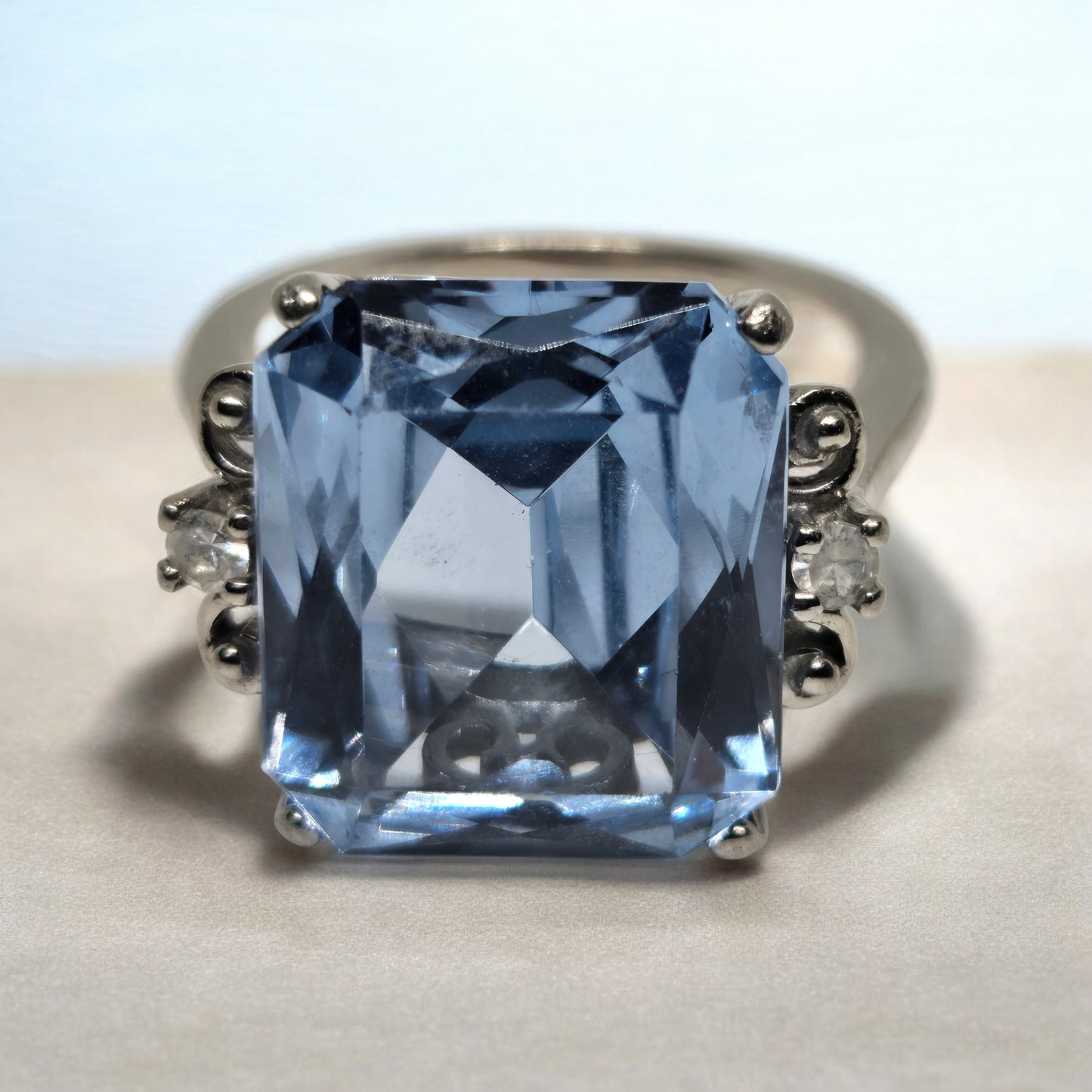 Blue Topaz Emerald Cut Cocktail Ring w/ Crystal Accents in White Gold